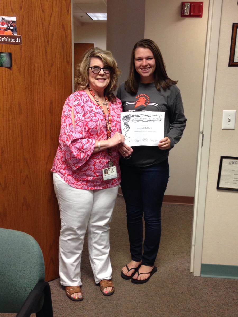 image of two people holding a certificate